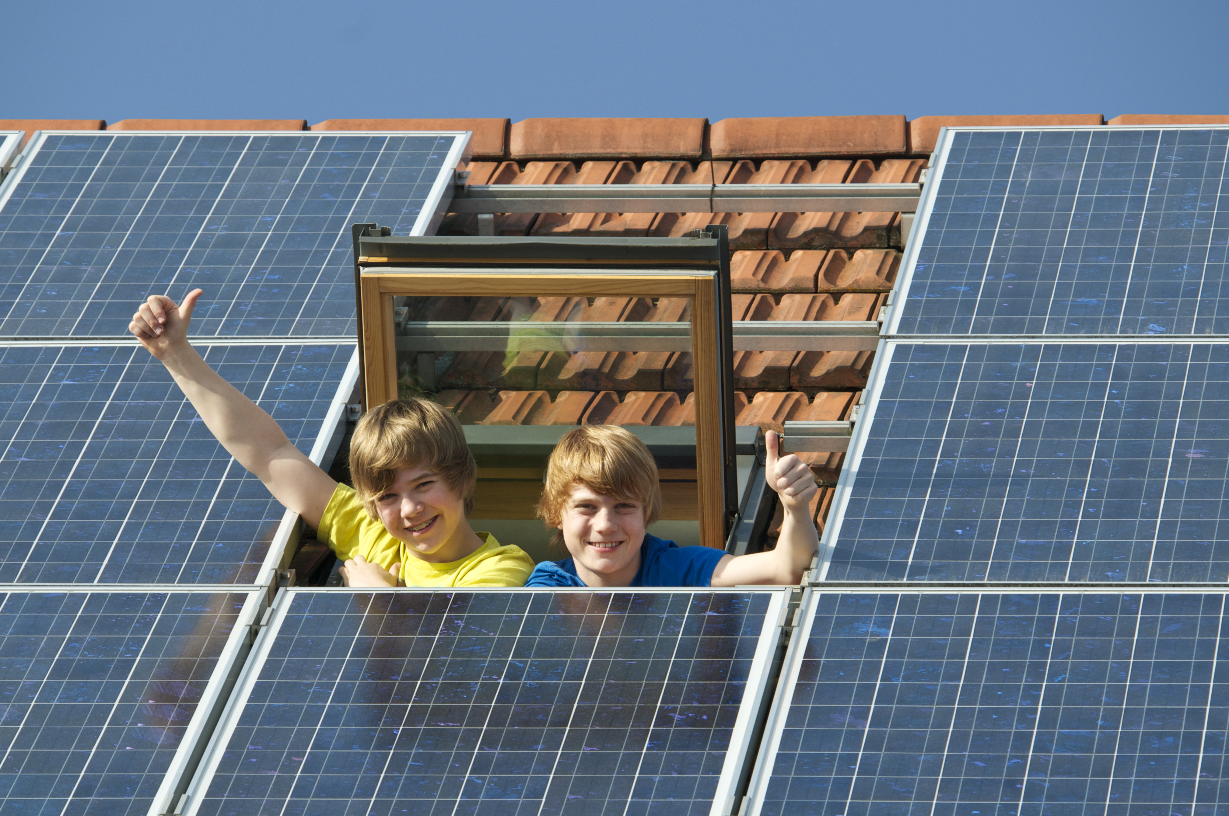 Kids in solar panel house